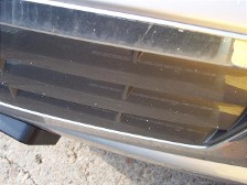 A cement truck dripped wet cement all over this new cadillac.